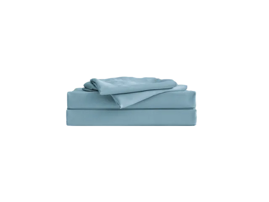 Folded light blue bedsheet set, neatly stacked.