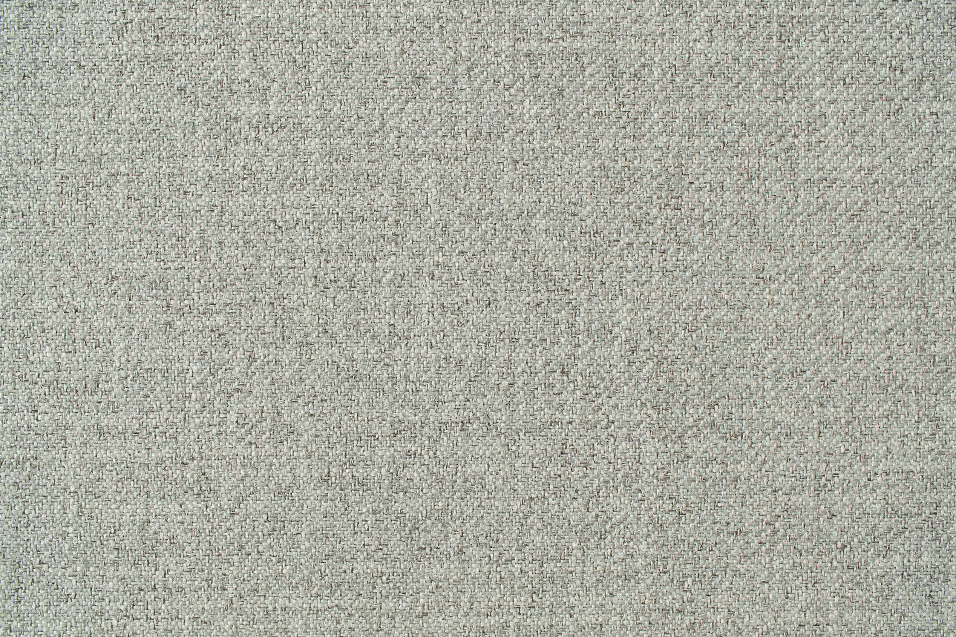 Close-up of light grey textured fabric, suitable for upholstery or furnishings. Subtle woven pattern adds depth and interest.