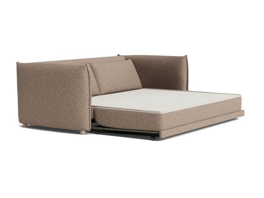 Brown L-shaped sofa with extended white mattress for a sofa bed function, featuring plush cushions and wooden legs.