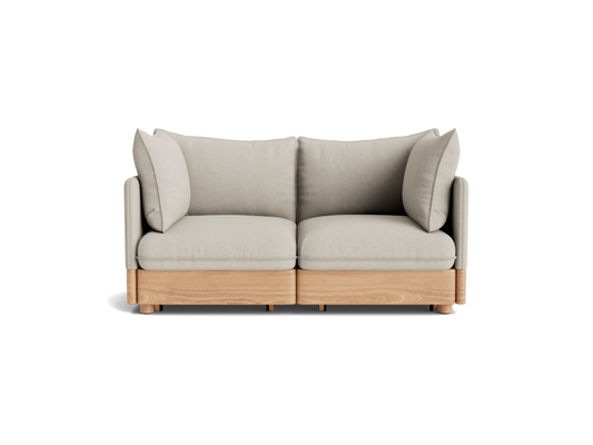 Light grey two-seater sofa with wooden base, featuring plush cushions and modern design. Perfect for contemporary living spaces.