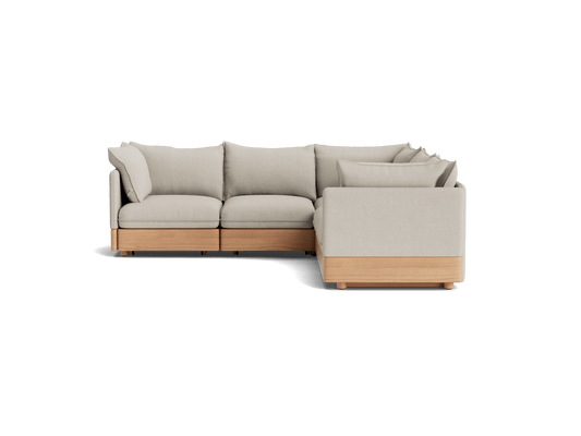 Light grey L-shaped sofa with wooden base and cushions, featuring a minimalist design.