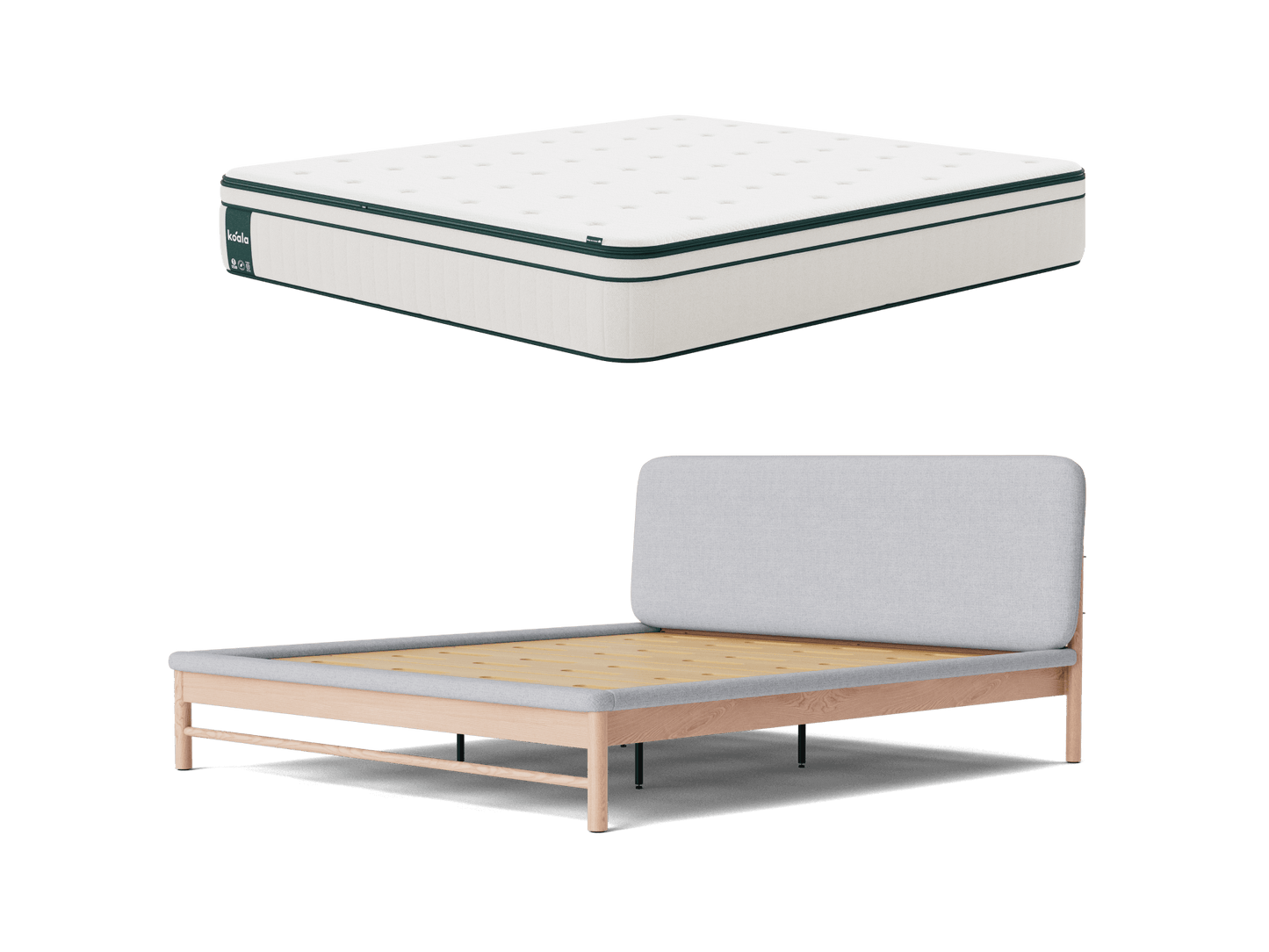 White mattress with dark green trim above a light wood bed frame with a light grey upholstered headboard. Simple, modern bedroom furniture.