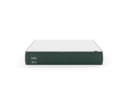 Dark grey mattress with white top, featuring a "koala" label. Simple, modern design ideal for stylish bedroom decor.