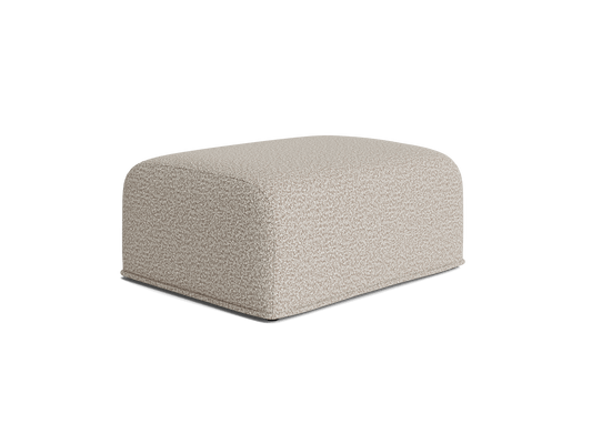 Beige rectangular ottoman with a soft, textured fabric surface and rounded corners. Ideal for modern living room decor.