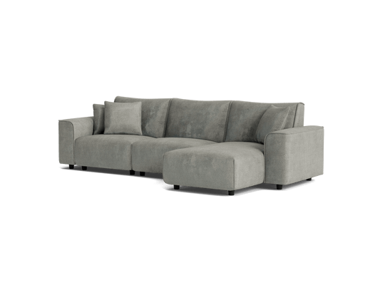 Light grey fabric sectional sofa with three cushions and a chaise. Modern design, suitable for contemporary living rooms.