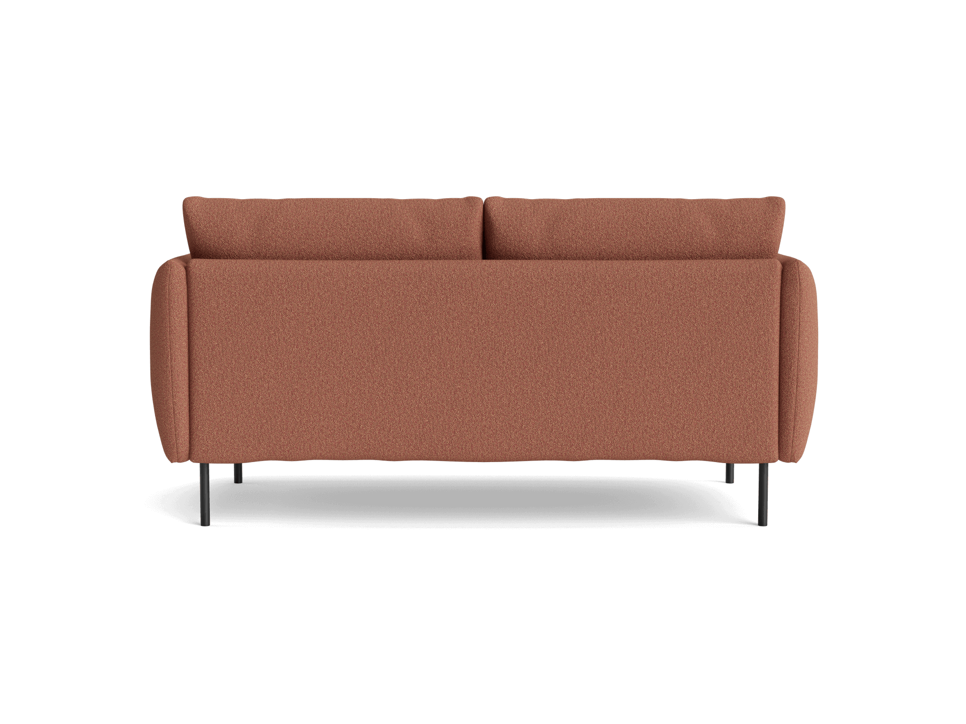 Rust-coloured sofa viewed from the back, featuring rectangular cushions and slender black metal legs.