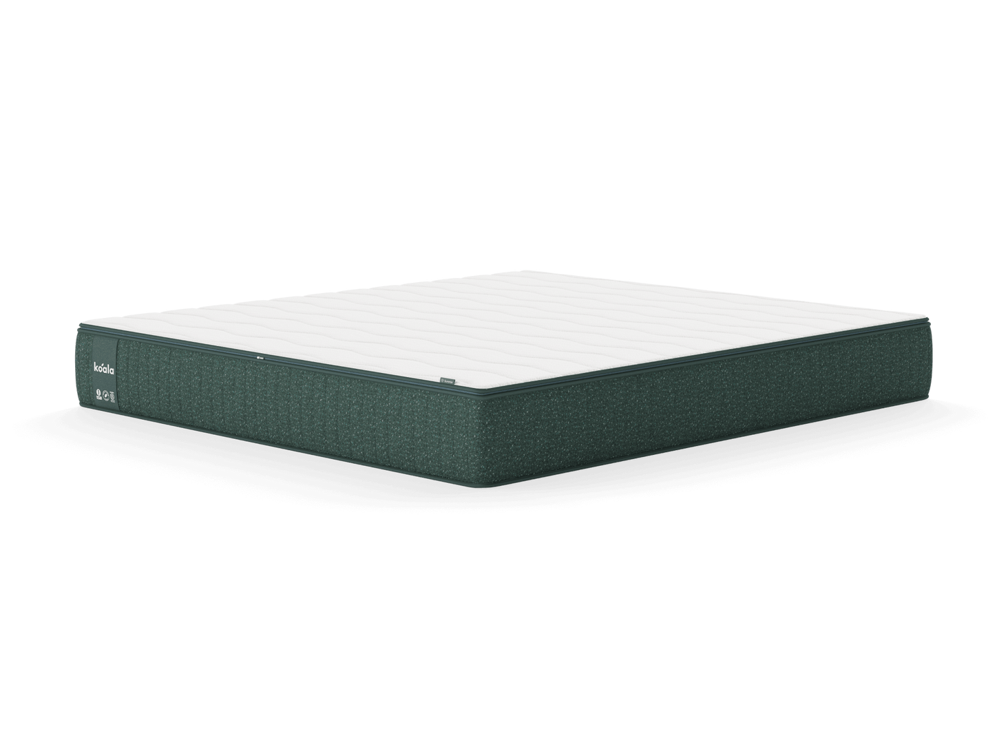 Green and white mattress with a textured side and a smooth, quilted top, viewed at an angle on a white background.