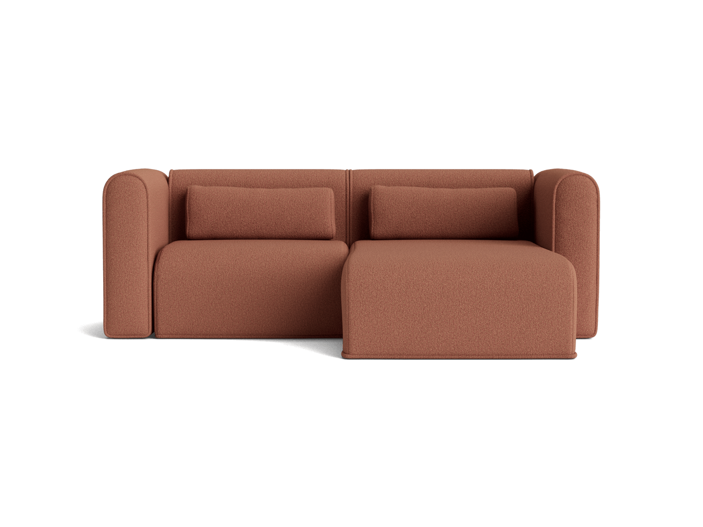 Rust brown sofa with two cushions and an attached chaise lounge. Modern design with rounded armrests.