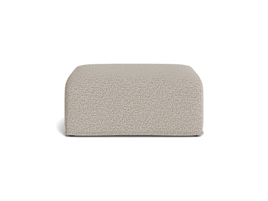 Light grey upholstered ottoman with a textured fabric. Rectangular shape, minimalistic design, suitable for modern living spaces.
