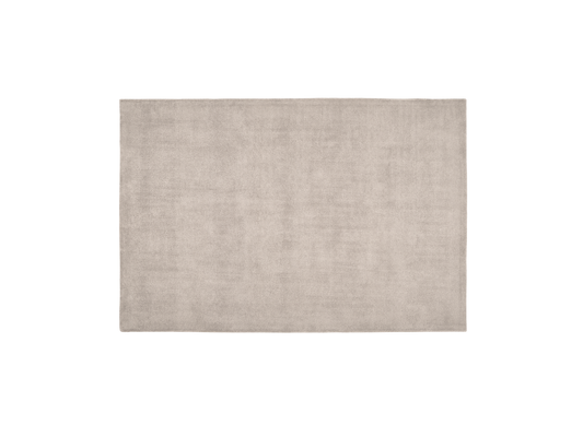 Rectangular beige rug with a plain, soft texture. Simple and elegant design for versatile interior decoration.