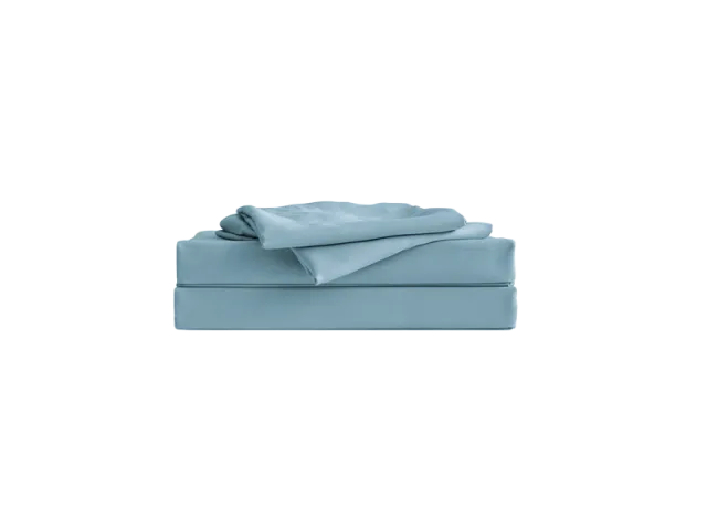 Folded light blue bedsheet set with fitted and flat sheets, neatly stacked and displayed against a plain background.