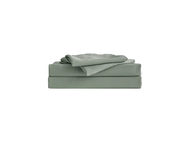 A sage green folded sheet set with a fitted and flat sheet stacked neatly on top of each other.