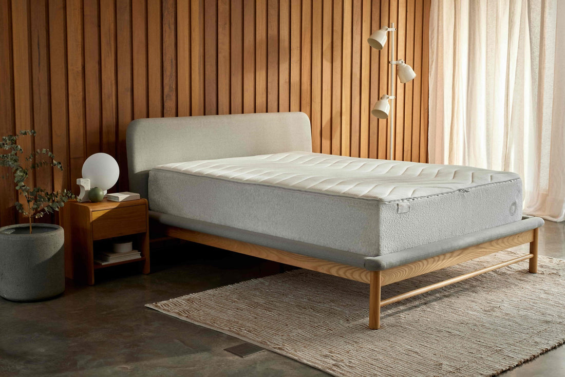 Beautiful new mattress on timber bed frame in modern bedroom, purchased after the owner realised their previous mattress need to be replaced