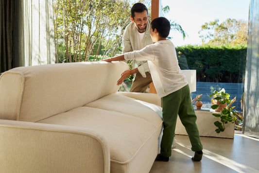 A father and son convert their Koala Cushy Sofa Bed from sit to sleep