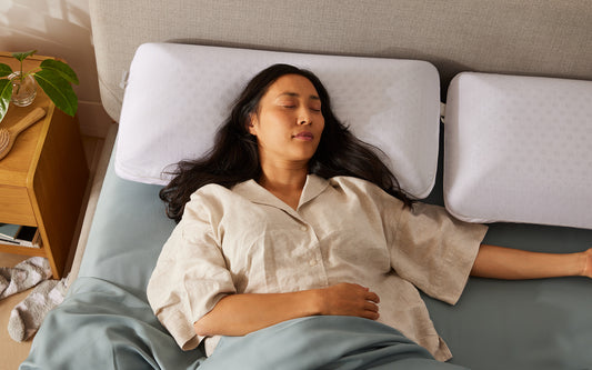 A woman sleeps soundly on her Koala pillow