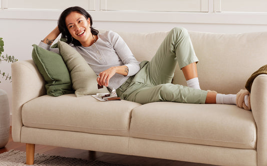 A woman relaxes on a Koala sofa, one of the best sofas for a living room