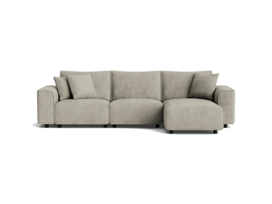 Light grey sectional sofa with three cushions and an attached chaise lounge on the right. Modern design with plush upholstery.