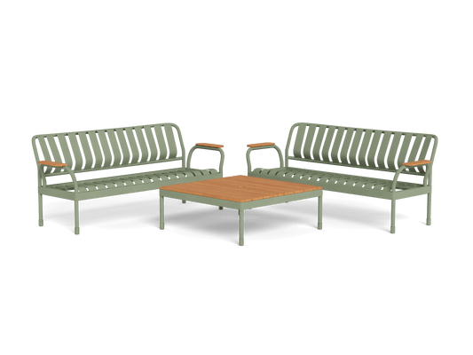 Green metal outdoor lounge set with two chairs and a rectangular wooden table in the centre.