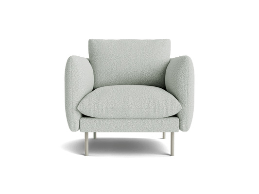 Light grey cushioned armchair with rounded armrests and backrest, supported by slender legs. Modern living room furniture design.