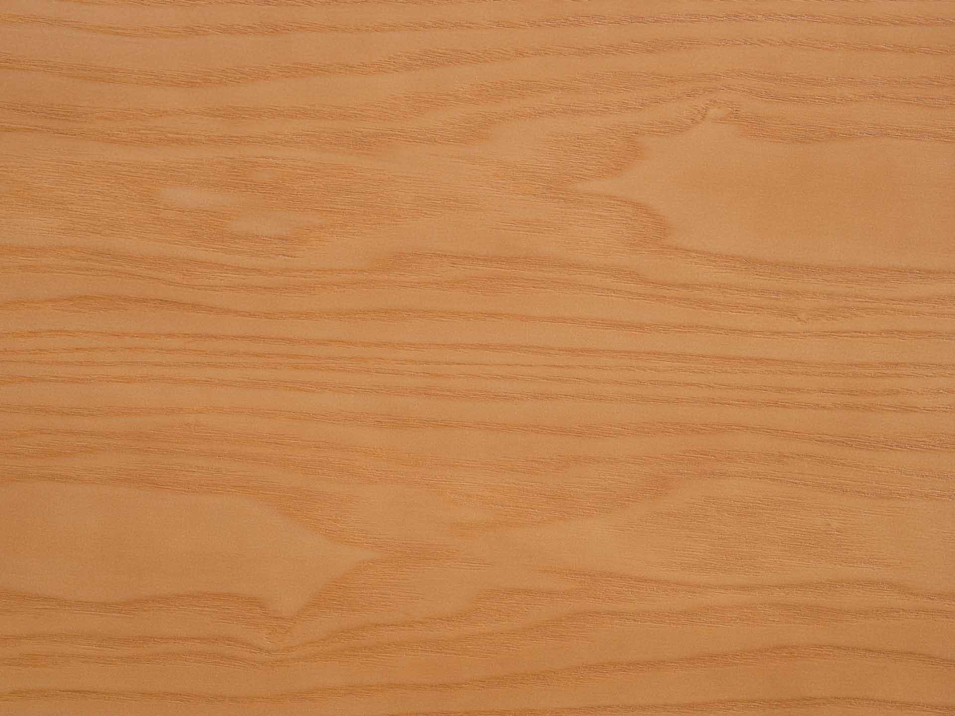 Close-up of a light brown wood grain surface with natural patterns, ideal for furniture design and interior finishes.