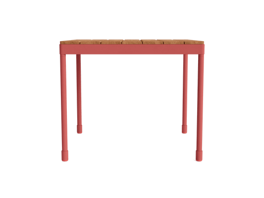 Wooden slat tabletop with red metal legs, rectangular design. Ideal as a patio or garden furniture item.