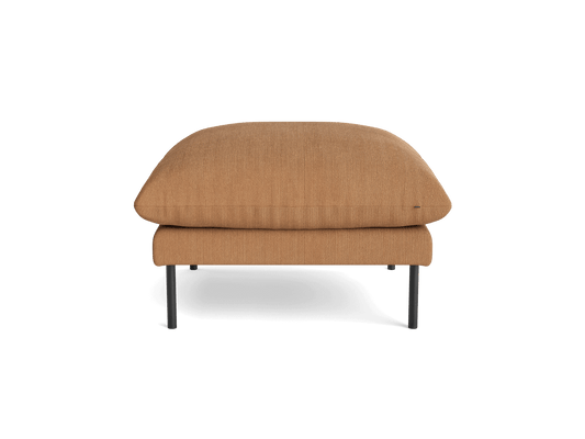 Brown upholstered ottoman with rounded cushion, metal legs, and minimalist design; perfect for modern living room furniture.