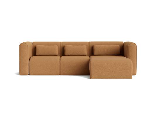 Brown sectional sofa with three seats and a chaise, featuring rounded armrests and plush cushions.