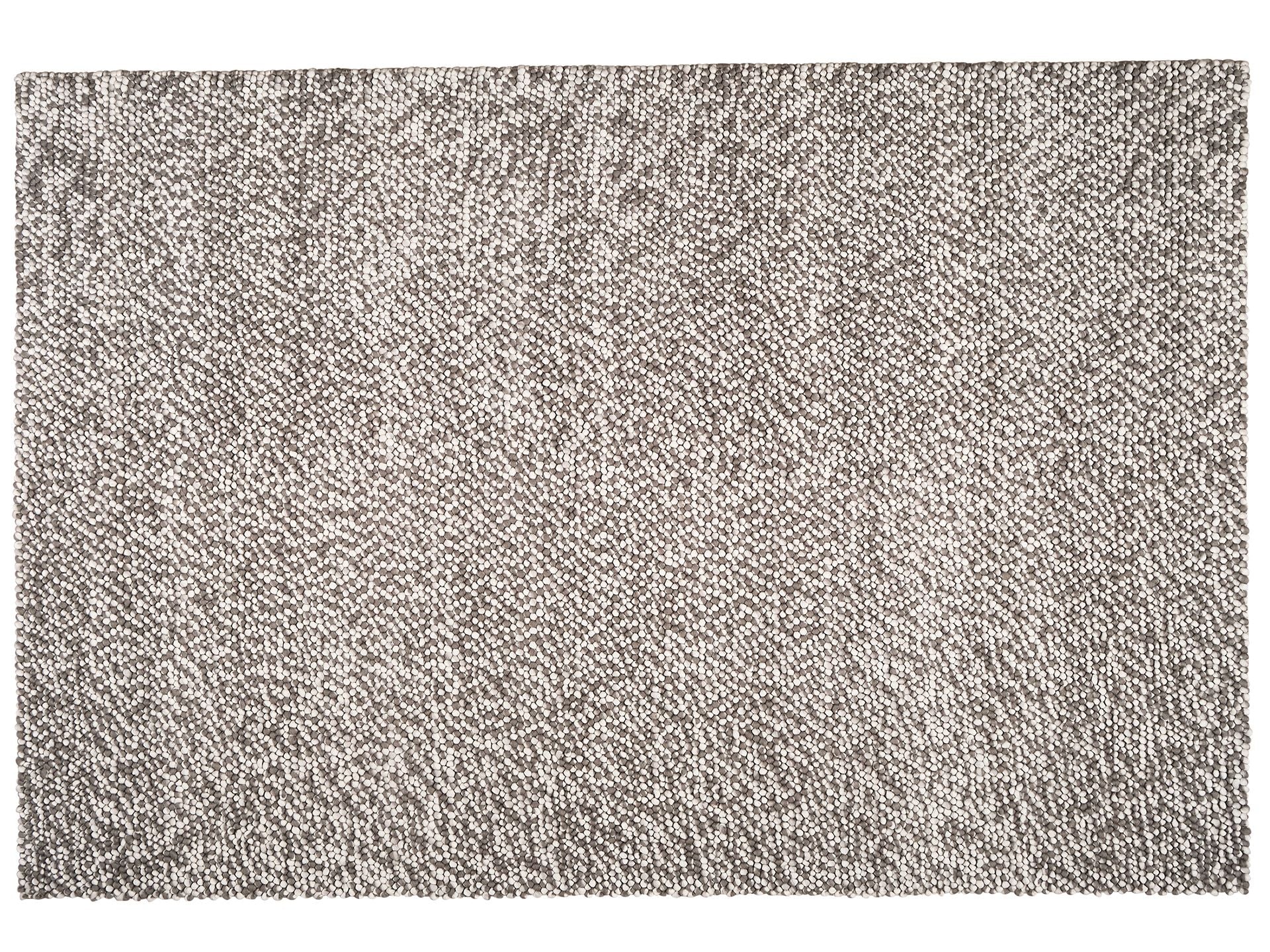 Grey woven rug with a subtle white speckled pattern. Rectangular shape, textured surface ideal for modern home decor or office spaces.