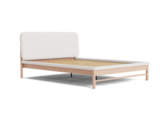 Modern bed frame with a light wood finish and a light grey upholstered headboard. Minimalist design, platform base. Perfect for bedroom decor.