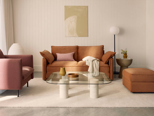 Terracotta corduroy Koala 2-seater sofa with dusty pink armchair and matching ottoman in bright living room