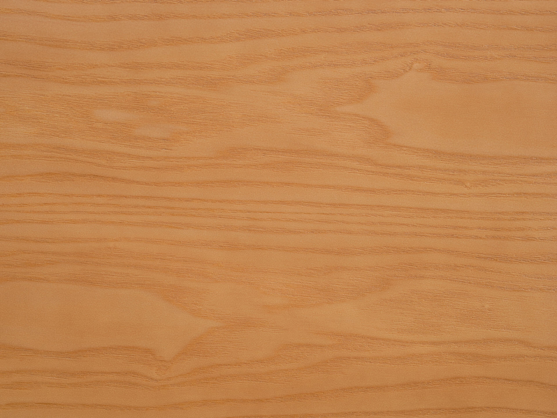 Close-up of light brown wood grain texture with subtle lines and patterns. Ideal for furniture design or interior decoration materials.