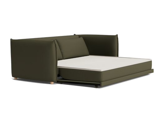 A dark green sofa bed with a pull-out white mattress; features cushioned armrests and backrest on wooden feet.
