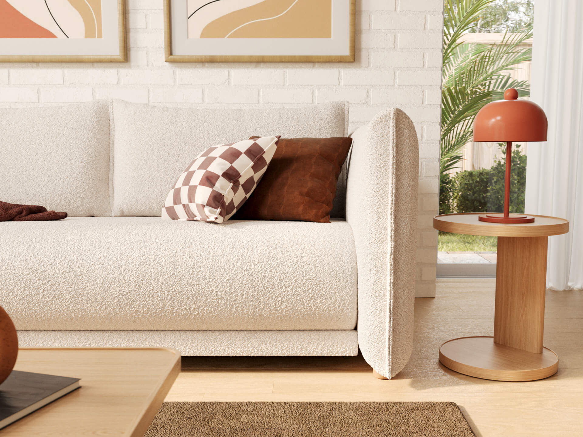 Modern living room with a white sofa, checkered and brown cushions, round wooden side table, decorative lamp, and abstract wall art.