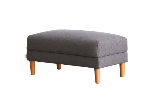 Grey upholstered ottoman with wooden legs. Perfect for living room furniture, adding style and functionality.