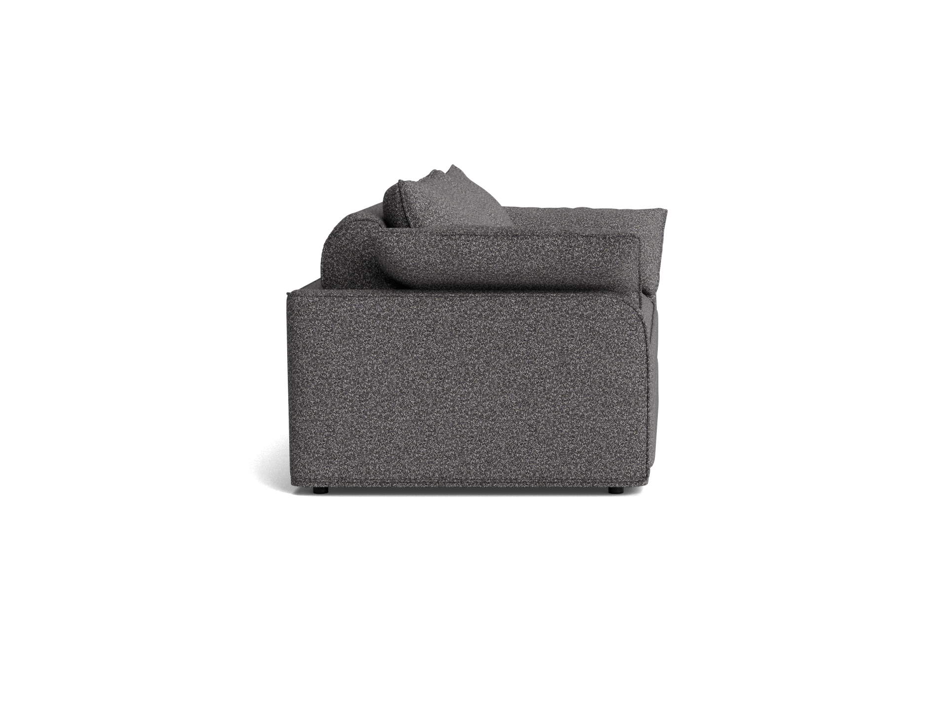 Side view of a dark grey fabric sofa with plush cushions and a boxy design.