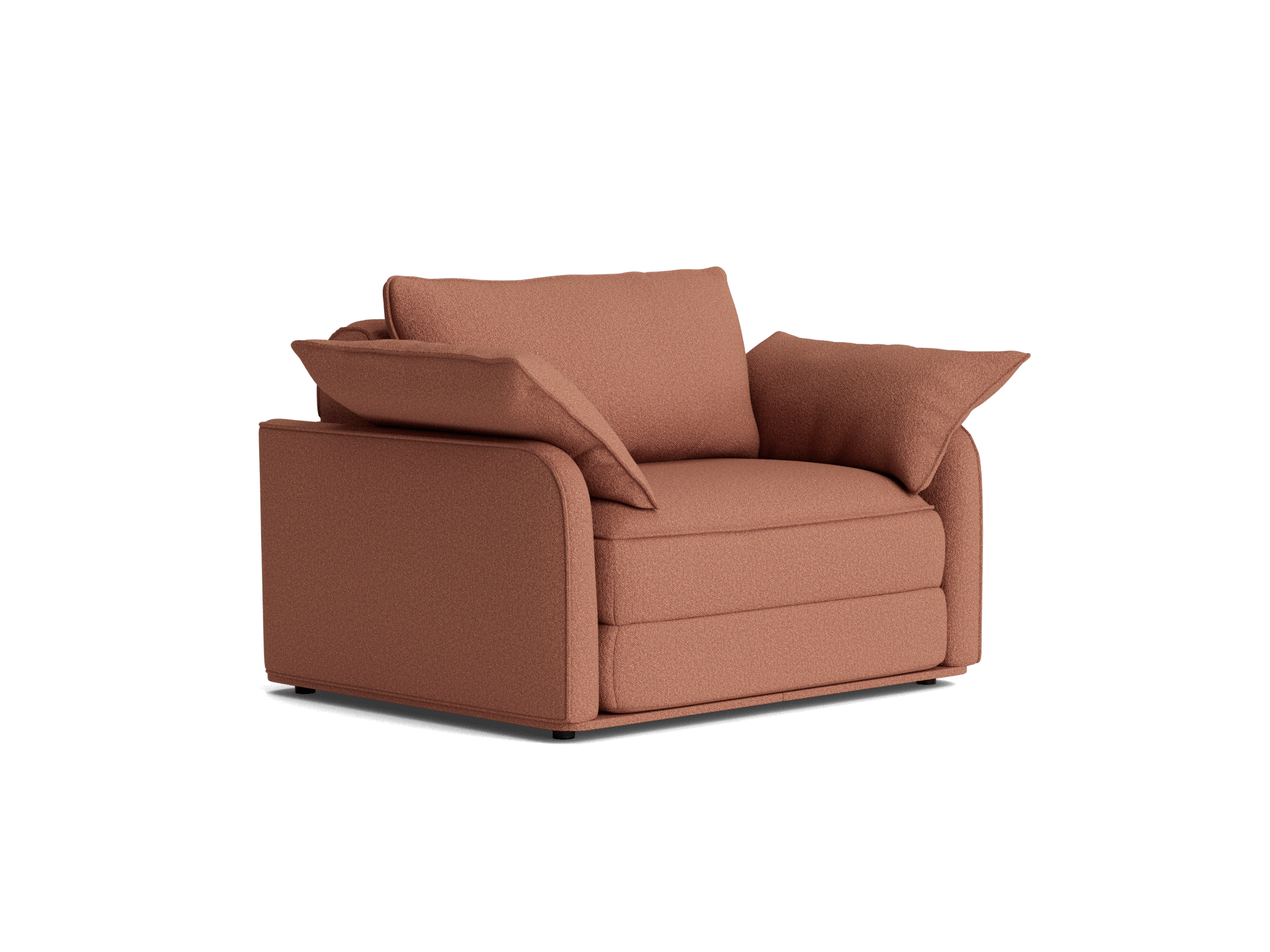 Rust-coloured armchair with plush, cushioned seating and two large side pillows, offering a cosy, modern aesthetic.