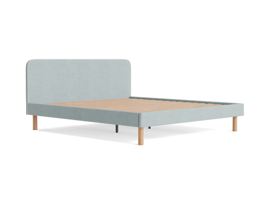Light grey upholstered bed frame with a low headboard and wooden slats. Features simple wooden legs. Modern bedroom furniture design.