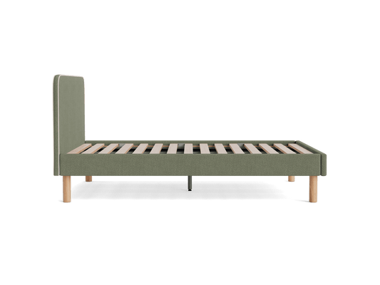 Green upholstered bed frame with a minimalist design, featuring wooden slats and light brown legs, viewed from the side.
