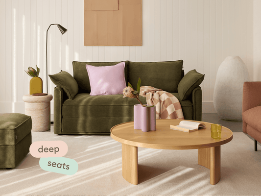 Man lounging on Koala Sofa Bed Double in olive green corduroy with deep seats text overlay overhead view