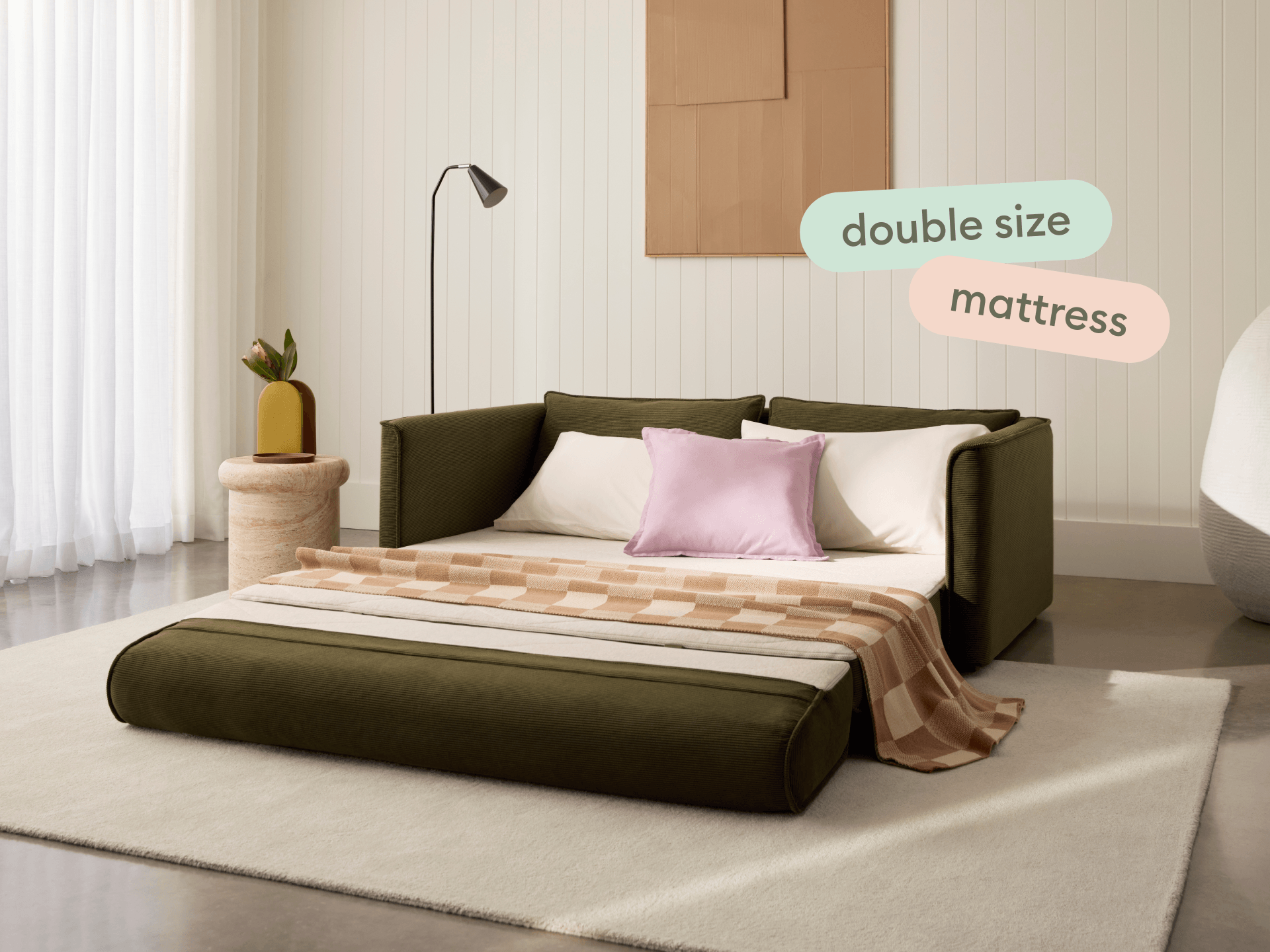 Koala Sofa Bed Double in olive green corduroy front view on grey studio background