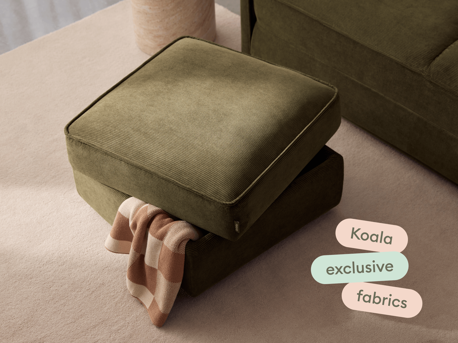 Ottoman in olive green corduroy close-up with Koala exclusive fabrics text overlay