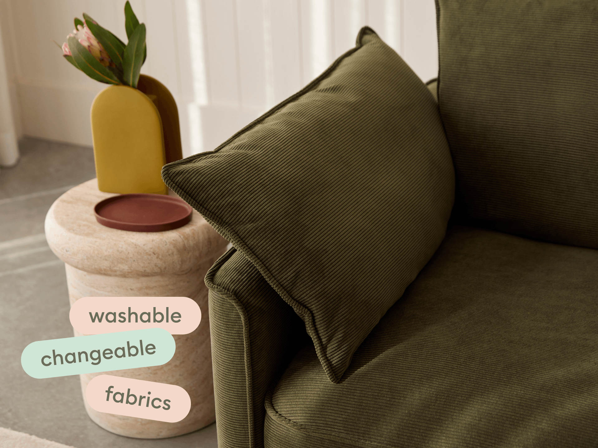 Koala Sofa Bed Queen in olive green corduroy close-up with washable changeable fabrics text overlay