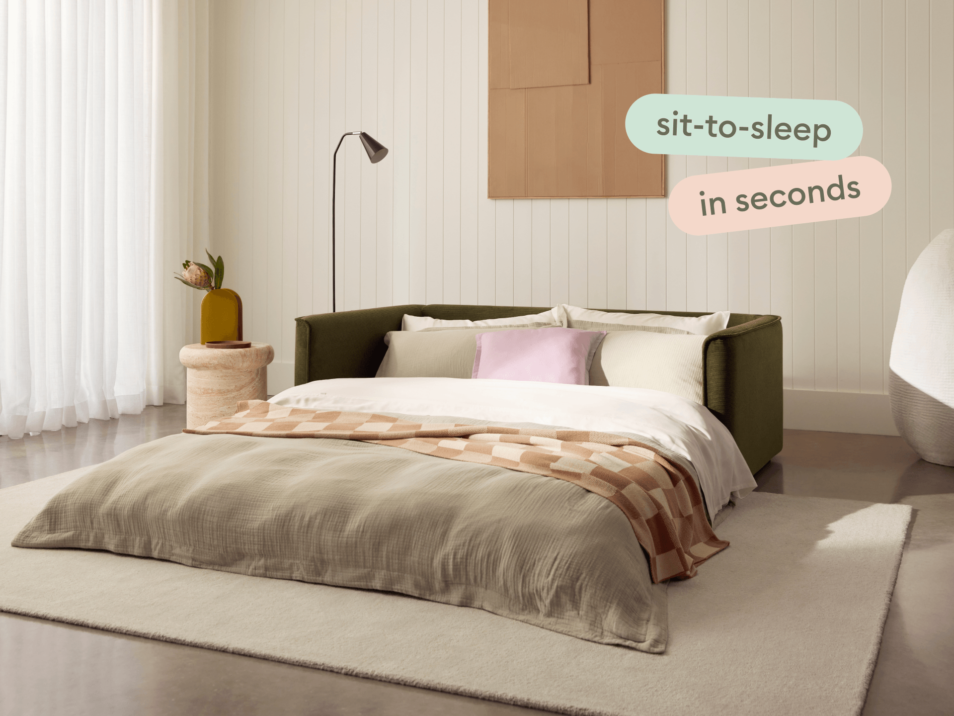 Man lounging on Koala Sofa Bed Queen in olive green corduroy with deep seats text overlay overhead view