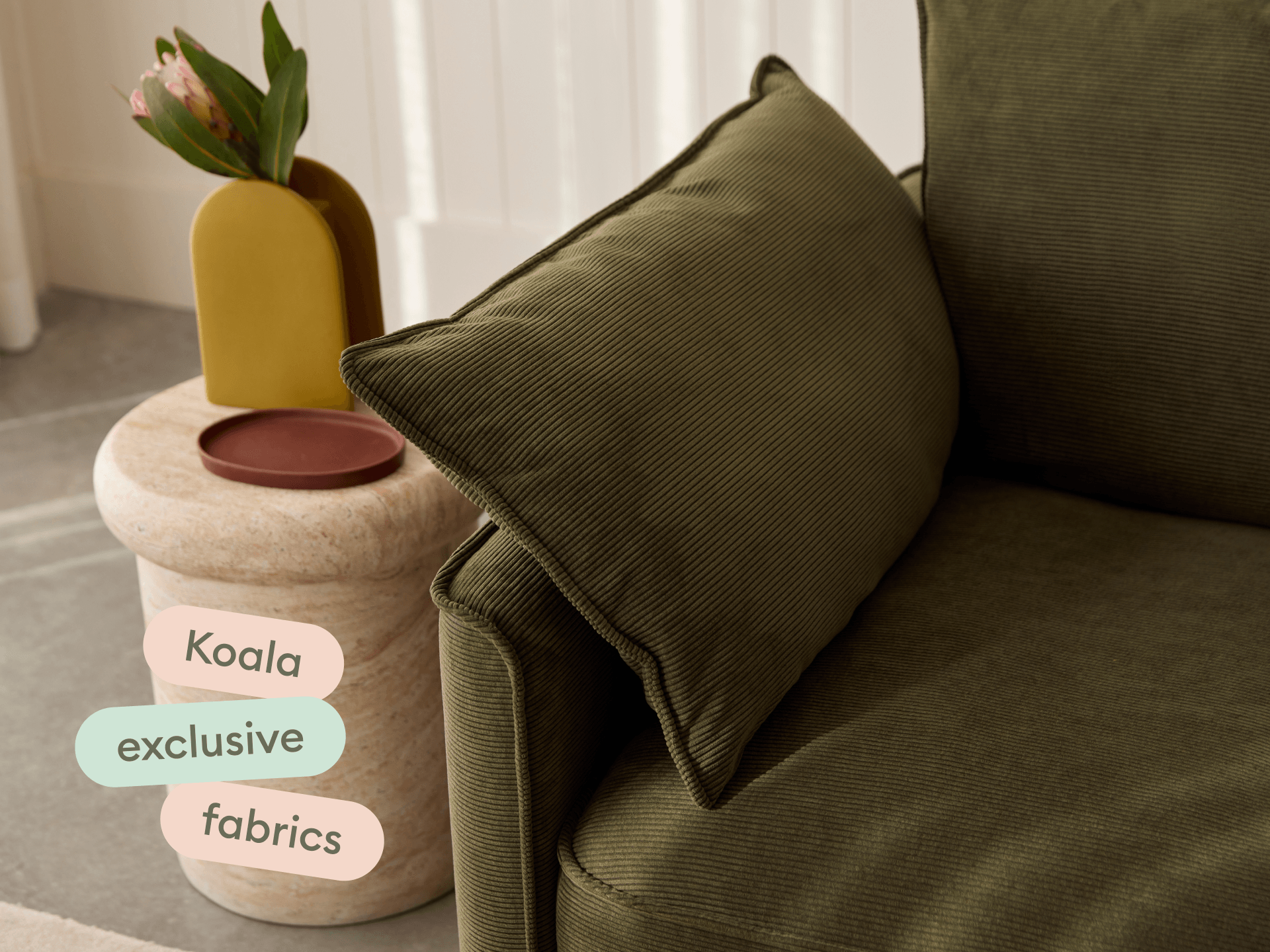 Koala Sofa Bed Single in olive green corduroy close-up with Koala exclusive fabrics text overlay