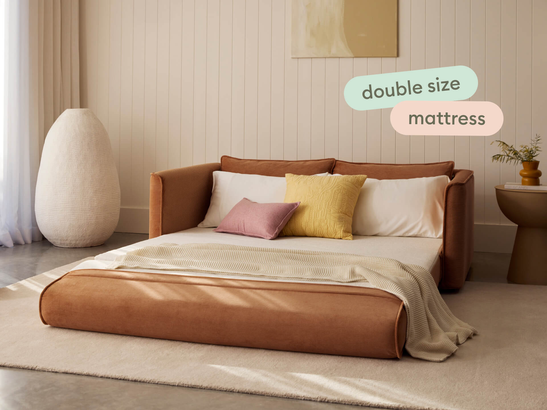 Koala Sofa Bed Double in terracotta corduroy studio product shot on grey background
