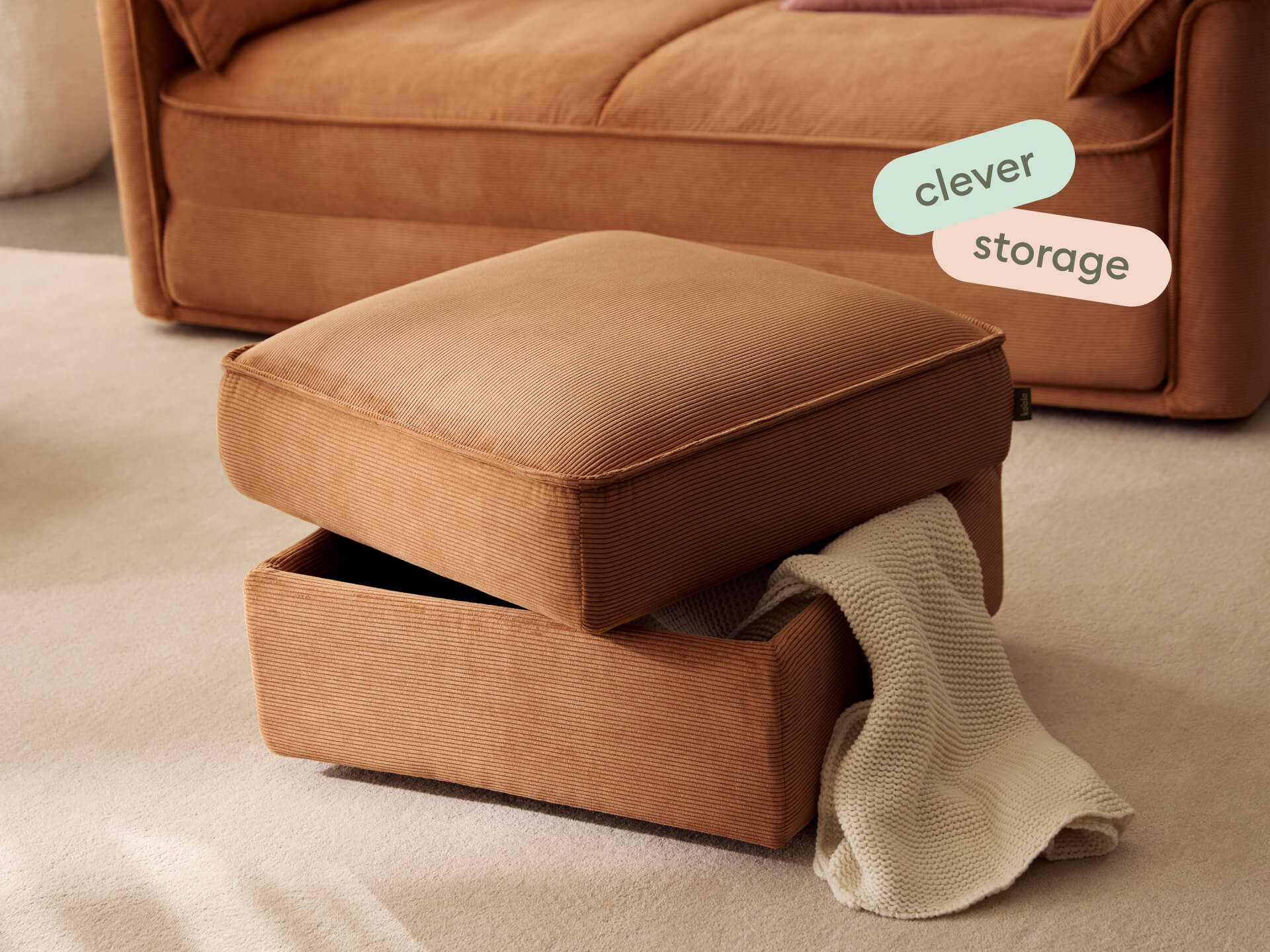 Koala Sofa Bed Ottoman in terracotta corduroy close-up with washable changeable fabrics text overlay