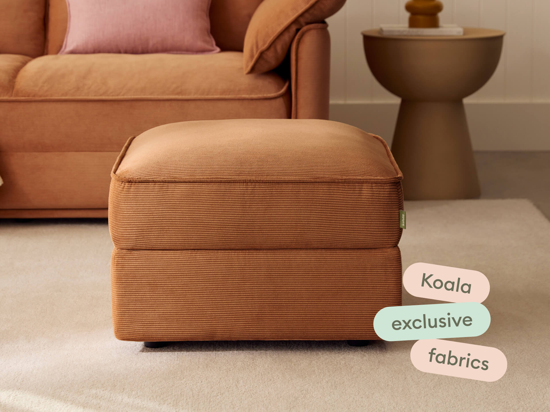 Ottoman in terracotta corduroy close-up with Koala exclusive fabrics text overlay