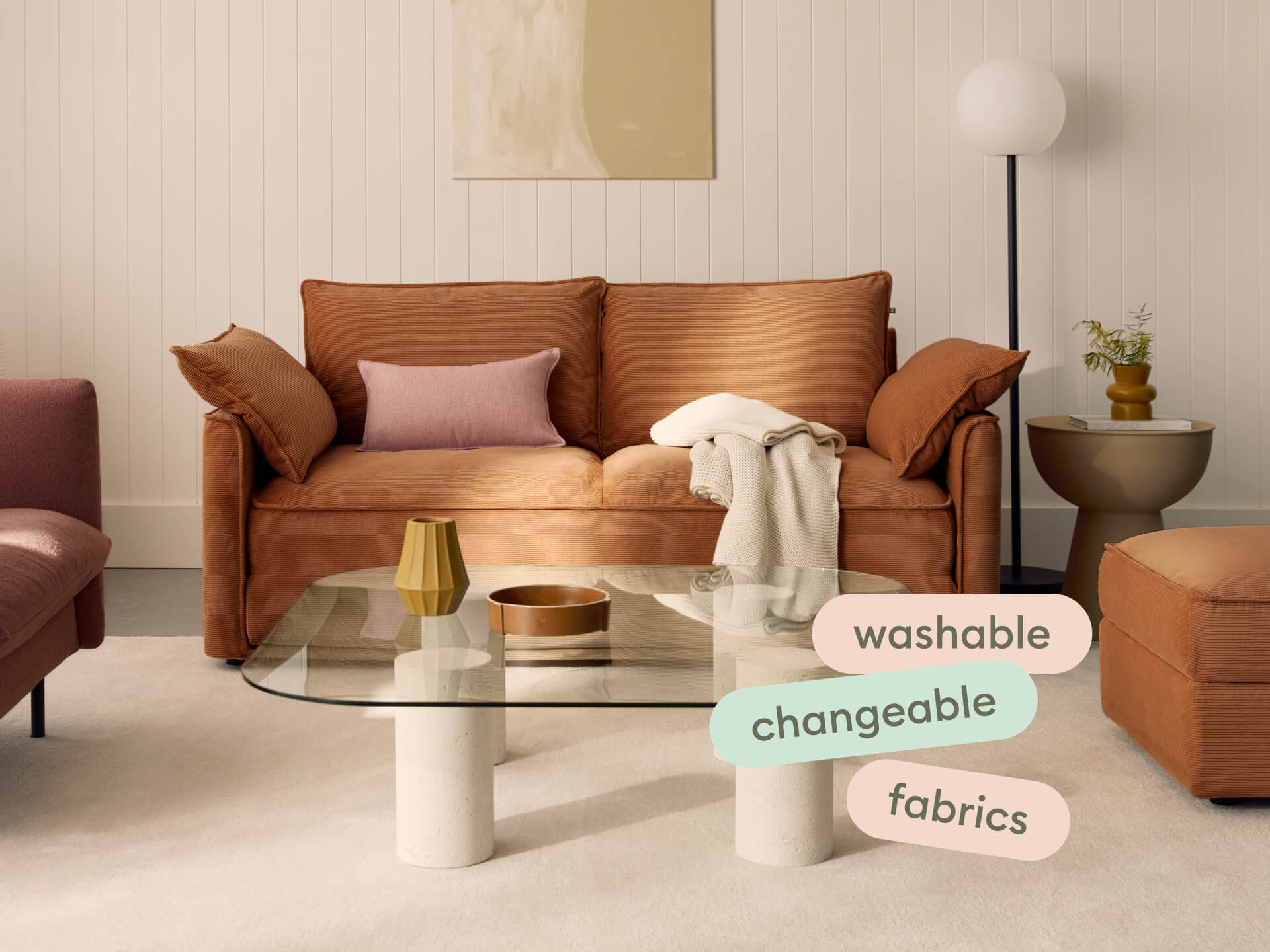 Koala Sofa Bed Single in terracotta corduroy close-up detail with pink cushion in styled setting