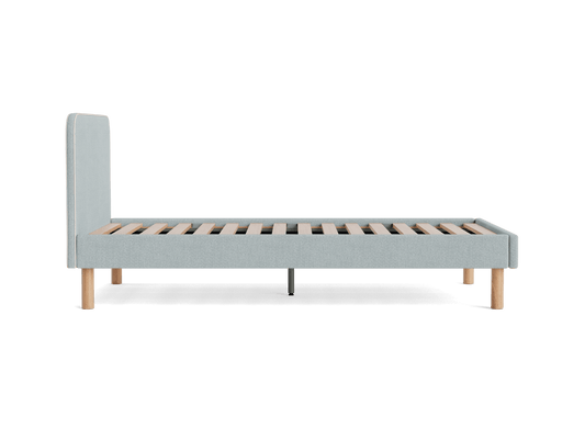 Light grey upholstered bed frame with a tall headboard and wooden slats, supported by round wooden legs.