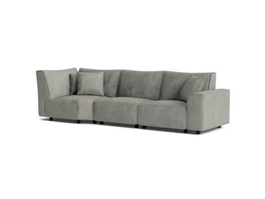 Light grey sectional sofa with three seats and one matching cushion, featuring wide armrests and a modern design.
